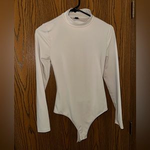 Cream tan colored express women’s size small bodysuit